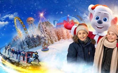 Ed im weihnachtlichen Kostüm mit zwei Kindern vor der Silhouette des weihnachtlichen Europa-Park