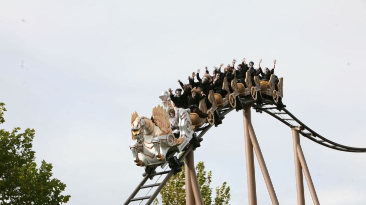 Guests dressed up for Halloween ride the Pegasus – The YoungStar Coaster in the Greek-themed area of Europa-Park.