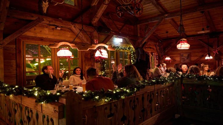 An interior view of the busy restaurant during the ERDINGER Hütt'n Evening in the Portuguese themed area of Europa-Park.