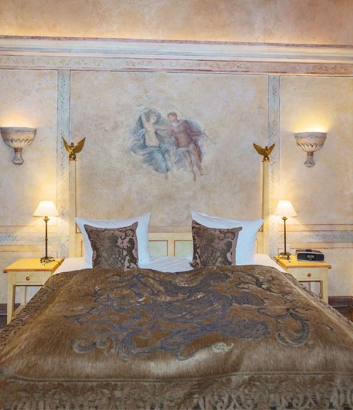 Schlafzimmer in der Suite Reale im Hotel "Colosseo"